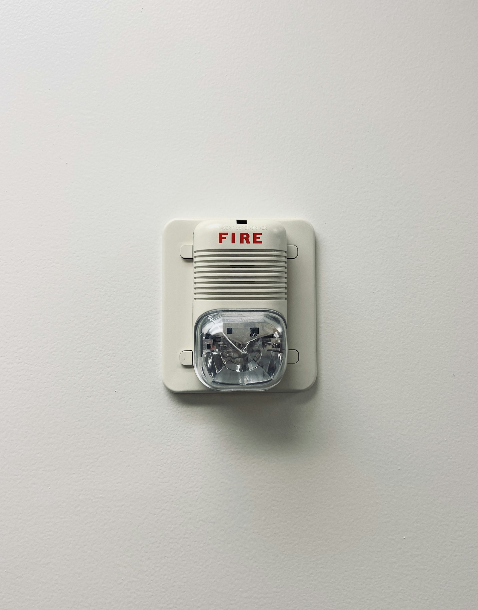 Fire alarm device mounted on a wall